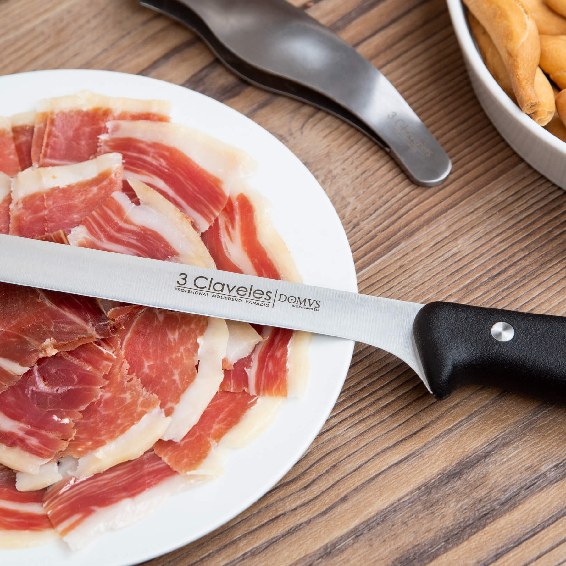 Emplatado de corte de jamón con cuchillo 3Claveles Domvs